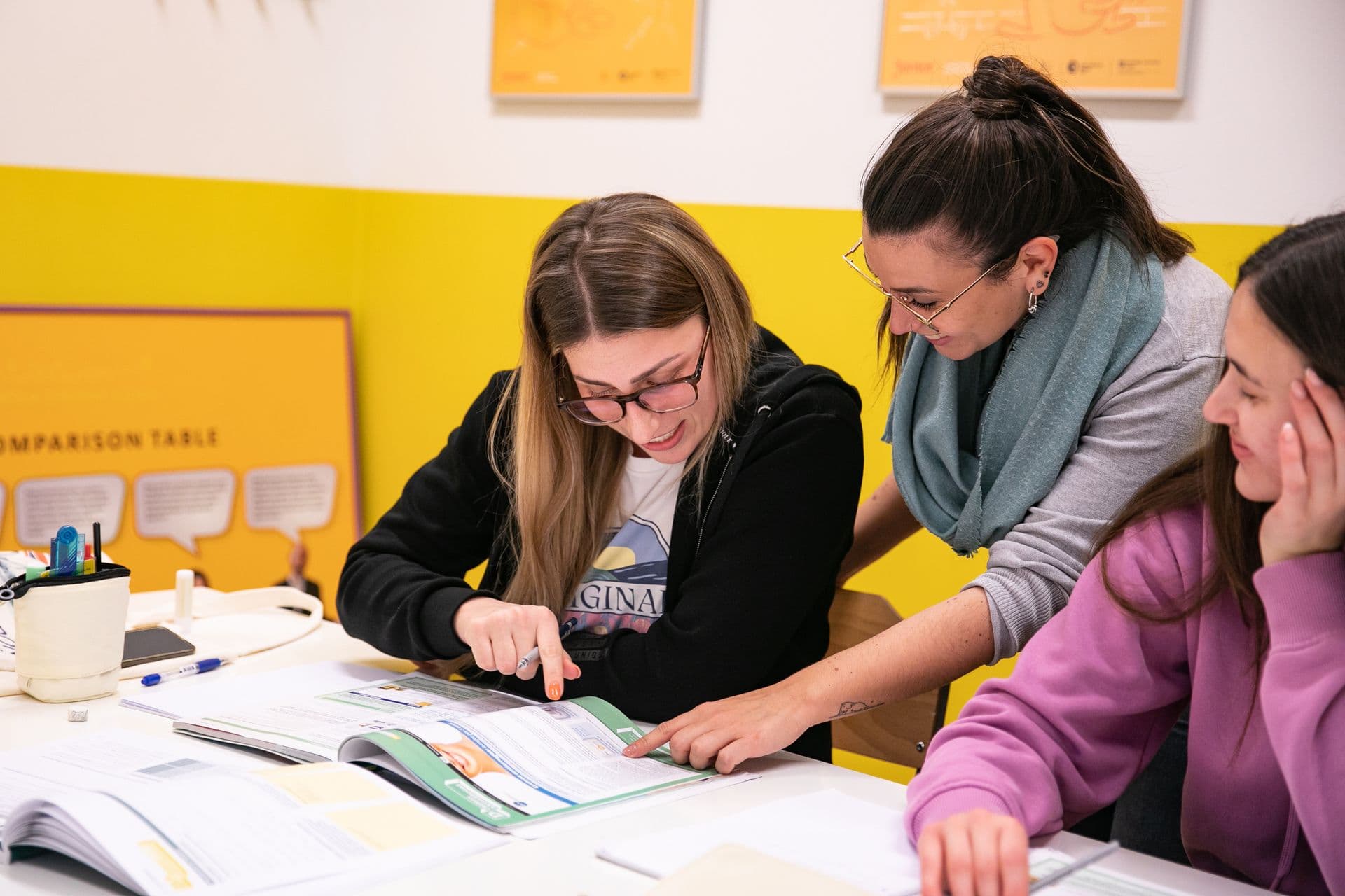 A teacher explaining a task to a group of learners